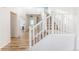 Bright foyer with hardwood floors, a staircase, and neutral paint at 973 Treece St, Louisville, CO 80027