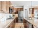 This kitchen has stainless steel appliances, beautiful counters and stunning wooden cabinets at 973 Treece St, Louisville, CO 80027