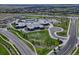 Aerial view of community with school, playground, and roads at 27192 E Frost Pl, Aurora, CO 80016