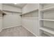 Large walk-in closet with hanging rods and shelving at 27192 E Frost Pl, Aurora, CO 80016