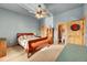 Bedroom featuring wood furnishings, a ceiling fan, and an en-suite bathroom at 2433 Dogie Spur, Golden, CO 80403