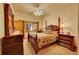 Comfortable bedroom features a four poster bed, ample natural light, and neutral colors at 2433 Dogie Spur, Golden, CO 80403
