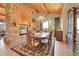 Charming dining room featuring a stone fireplace and a beautiful view at 2433 Dogie Spur, Golden, CO 80403