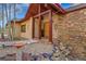 Stunning front entrance featuring stone accents and a well-manicured front yard at 2433 Dogie Spur, Golden, CO 80403
