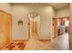 Inviting hallway featuring tile flooring, archway entrance, and multiple wooden doors and trim at 2433 Dogie Spur, Golden, CO 80403