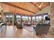 Inviting living room features high ceilings, tile floors, large windows with scenic views, and comfortable seating at 2433 Dogie Spur, Golden, CO 80403