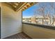 Small apartment balcony with wooden flooring and view of other buildings at 444 S Kittredge St # 205, Aurora, CO 80017