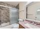 Bathroom with granite countertop, tiled shower, and a full bathtub at 444 S Kittredge St # 205, Aurora, CO 80017