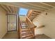 Indoor view of a wooden staircase leading to upper levels at 444 S Kittredge St # 205, Aurora, CO 80017