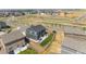 Aerial view shows the home, backyard, neighborhood, and close proximity to shops at 920 William Way, Brighton, CO 80603