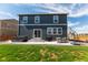 Backyard features a patio with a hot tub and furniture, perfect for relaxing or entertaining at 920 William Way, Brighton, CO 80603