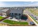 Aerial view of a backyard with green grass, hot tub, patio and privacy fence at 920 William Way, Brighton, CO 80603