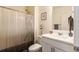 Bright bathroom with a shower-tub combo, elegant vanity, framed mirror, and neutral décor for a relaxing experience at 920 William Way, Brighton, CO 80603
