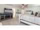 Cozy bedroom featuring a fireplace, TV, white bed frame and coordinated furniture at 920 William Way, Brighton, CO 80603
