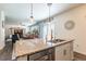 Open kitchen with granite counters that overlooks the dining room and the living room at 920 William Way, Brighton, CO 80603