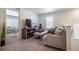 Comfortable living area featuring stylish furnishings, a TV, and access to other rooms at 920 William Way, Brighton, CO 80603