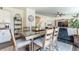 Open-concept living area with dining room offering a seamless flow and plenty of natural light at 920 William Way, Brighton, CO 80603