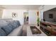 Relaxing living area with comfortable seating, modern entertainment center, and bright lighting at 920 William Way, Brighton, CO 80603