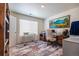 Bright home office featuring a large window, neutral walls, and stylish decor at 920 William Way, Brighton, CO 80603