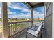 Relax on the porch with comfortable seating and a view of the neighborhood at 920 William Way, Brighton, CO 80603
