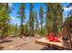 The backyard deck offers a tranquil setting surrounded by nature, ideal for unwinding and enjoying the outdoors at 91 Slalom Dr, Breckenridge, CO 80424
