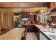 Charming kitchen features wood ceiling, cabinets, appliances and table at 91 Slalom Dr, Breckenridge, CO 80424
