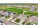 Neighborhood aerial view with well-maintained homes, sidewalks, green spaces, and a playground, showcasing community charm at 7218 Animas Ave, Frederick, CO 80530