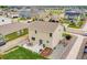 Aerial view of a home with a patio, grill, and backyard, showcasing its outdoor living spaces and neighborhood at 7218 Animas Ave, Frederick, CO 80530