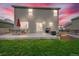 Spacious backyard with a patio, dining set, grill, and garden bed, providing ample space for outdoor enjoyment at 7218 Animas Ave, Frederick, CO 80530