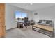 Office/bedroom with lots of natural light and large windows. Features modern furniture and carpeted floor at 7218 Animas Ave, Frederick, CO 80530