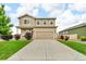 Charming two-story home with landscaped front yard, long driveway, and attached two-car garage at 7218 Animas Ave, Frederick, CO 80530