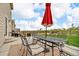 Outdoor patio featuring a dining set with an umbrella and grill, perfect for entertaining and enjoying the outdoors at 7218 Animas Ave, Frederick, CO 80530