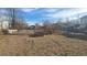 Vacant lot with sparse vegetation and a chain link fence at 3818 S Lowell Blvd, Sheridan, CO 80236