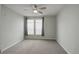 Cozy bedroom with neutral walls, carpeted floors, a ceiling fan, and natural light at 10184 Park Meadows Dr # 1406, Lone Tree, CO 80124