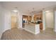 Bright kitchen features stainless steel appliances, an island with pendant lighting, and wood cabinets at 10184 Park Meadows Dr # 1406, Lone Tree, CO 80124