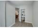 Bright living room featuring wood floors and built-in shelving perfect for displaying decor at 10184 Park Meadows Dr # 1406, Lone Tree, CO 80124