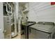 Utility room with modern washer and dryer, plus furnace and overhead shelving for storage at 10184 Park Meadows Dr # 1406, Lone Tree, CO 80124