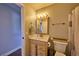 Well-lit bathroom featuring a vanity and a toilet at 1922 S Ivory Way, Aurora, CO 80013