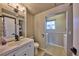 Functional bathroom with a modern vanity, neutral color palette, and integrated laundry area at 1922 S Ivory Way, Aurora, CO 80013