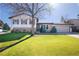 Charming two-story home with a well-maintained lawn and mature trees at 1922 S Ivory Way, Aurora, CO 80013