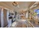 Modern kitchen with stainless steel appliances, light cabinets, tile floors and eat-in kitchen area at 1922 S Ivory Way, Aurora, CO 80013