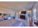 Large bedroom with TV, dresser, ensuite bath and walk-in closet at 1922 S Ivory Way, Aurora, CO 80013