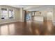 Open basement area with hardwood floors, recessed lighting, large windows, a wet bar and access to an outdoor area at 6878 Northstar Ct, Castle Rock, CO 80108