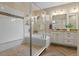 Luxurious bathroom features a large shower with a tub and a granite vanity at 6878 Northstar Ct, Castle Rock, CO 80108