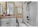 Bathroom with white tiled shower and tub, granite countertop, white vanity, matching framed mirror and neutral colored walls at 6878 Northstar Ct, Castle Rock, CO 80108