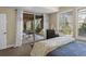 Bedroom with a sliding glass door to an outdoor area with stairs, neutral carpet and walls and a dark wood dresser at 6878 Northstar Ct, Castle Rock, CO 80108