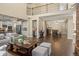 Spacious living room featuring hardwood floors, an open layout, and modern decor at 6878 Northstar Ct, Castle Rock, CO 80108
