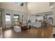 Open-concept living room with tall ceilings, hardwood floors, and plenty of natural light at 6878 Northstar Ct, Castle Rock, CO 80108