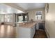 Basement wet bar with granite countertops, white cabinets, stainless steel sink, and a beverage cooler for entertaining at 6878 Northstar Ct, Castle Rock, CO 80108