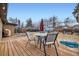 Spacious backyard with a wooden deck, comfortable seating, and a well-maintained lawn at 1519 S Lowell Blvd, Denver, CO 80219
